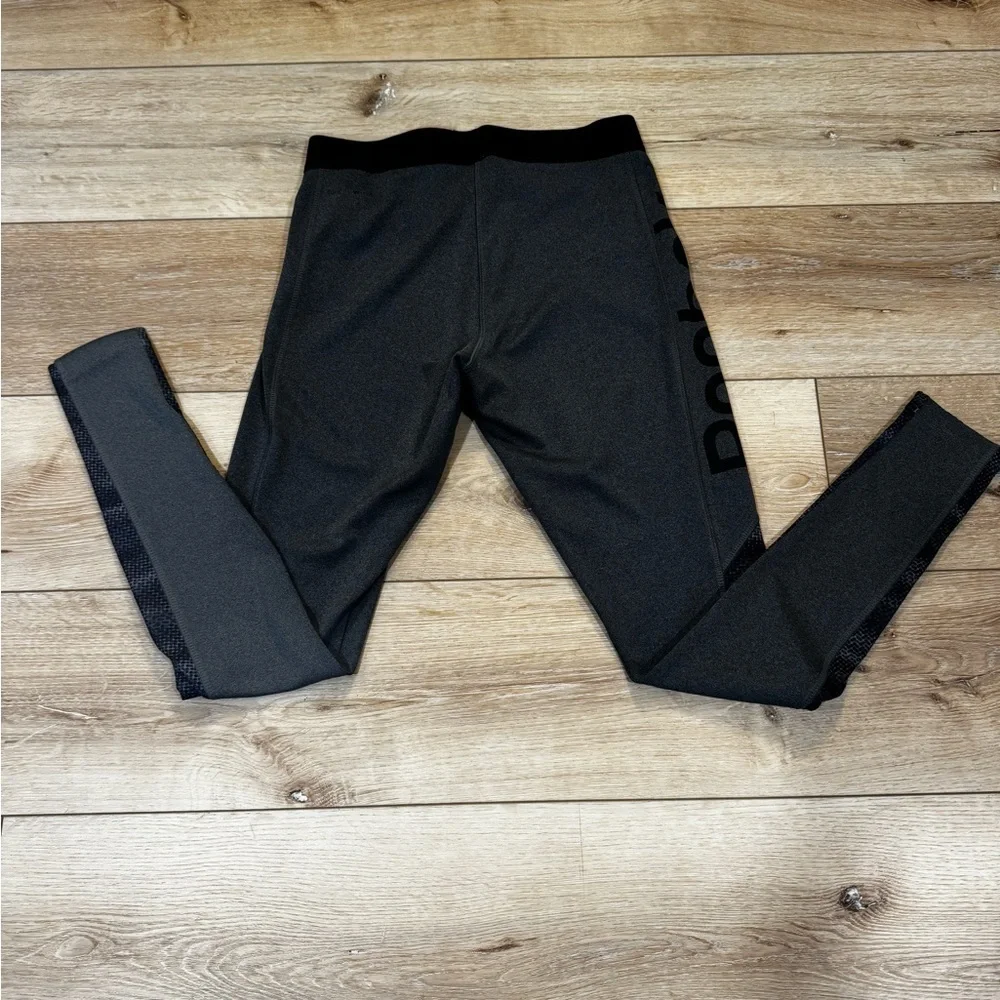 Reebok charcoal gray athletic leggings, mesh patterned detailing on side, S.